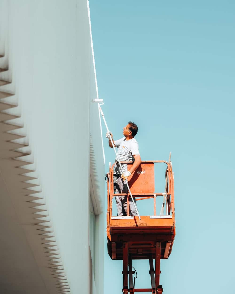 Exterior painting in progress on a contemporary home